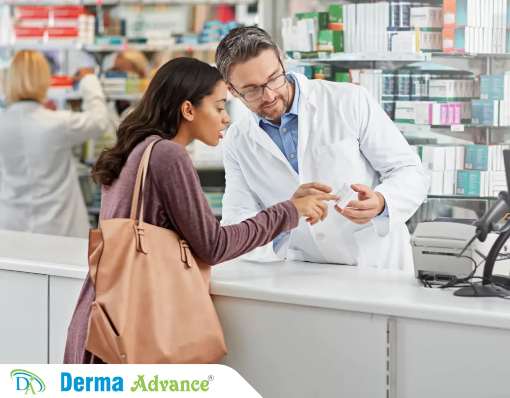 Image of a pharmacy showing a lady purchasing over the counter medication to avoid redness of Pimples.