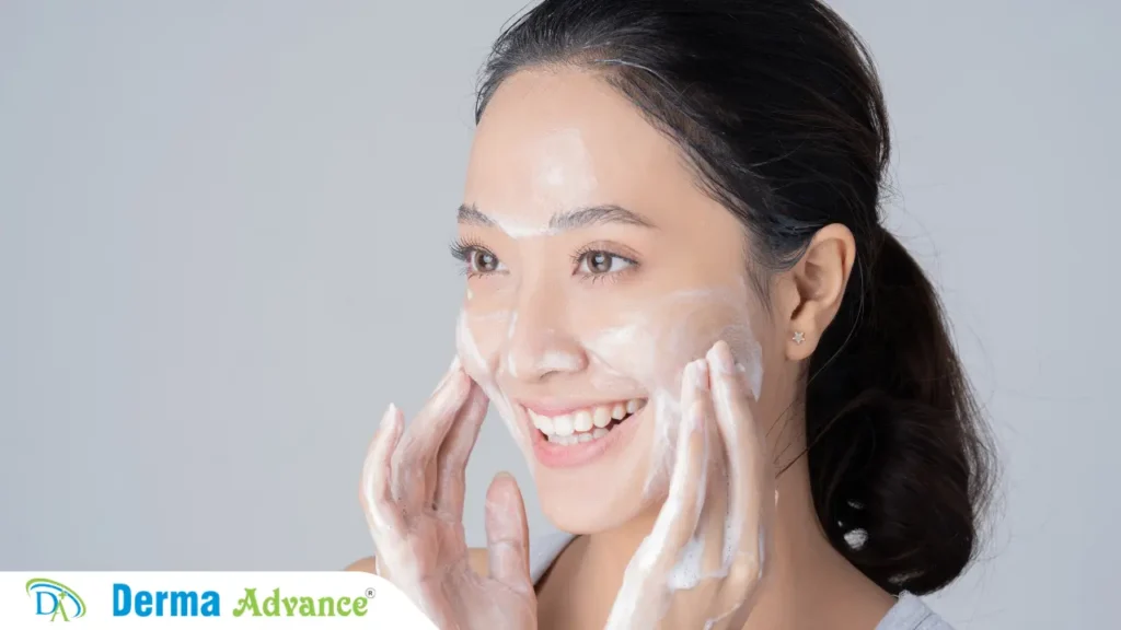 A lady cleansing her face as part of her anti aging skincare routine.