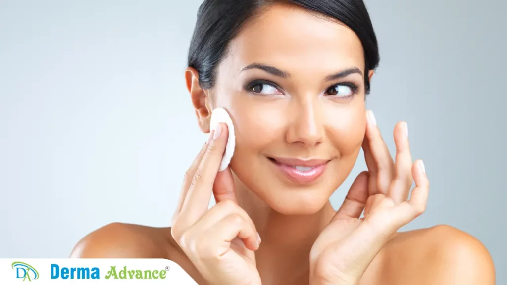 A lady applying toner on her face as part of her anti aging skincare routine.